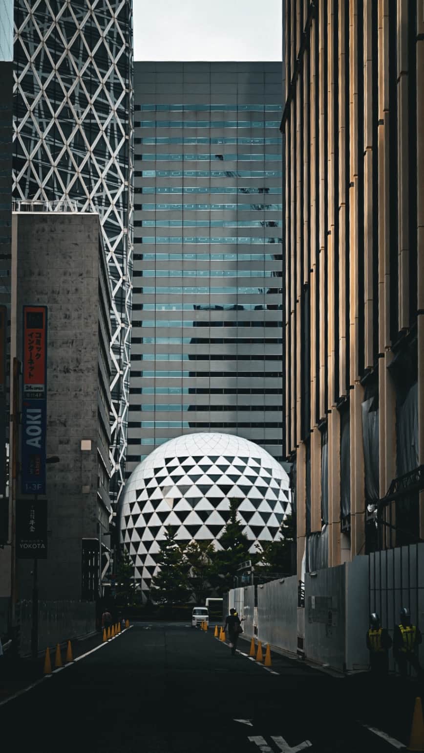 Futuristic Urban Architecture in Tokyo: Geometric Sphere and Skyscrapers